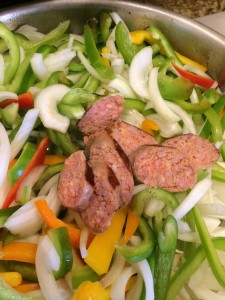 sausage with bell peppers and onions, confit